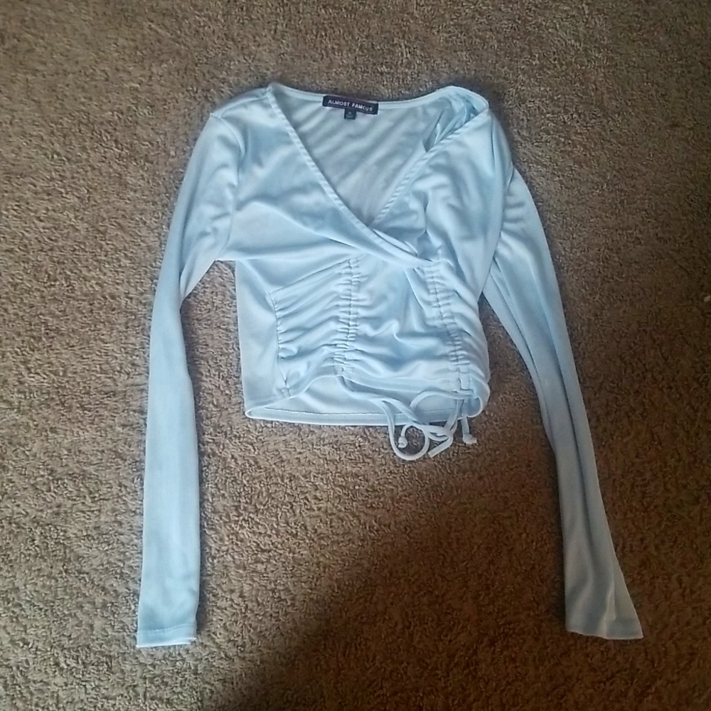 A baby blue shirt.
